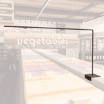 Natural Collection's aisle outrigger with wood background on t-bracket to be mounted on spine of aisle shelves or gondolas.