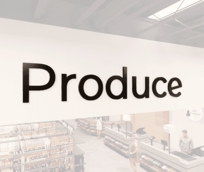 Modern Collection's Produce dept wayfinding sign that is wall mounted dimensional wood letters with metal laminate faces.