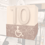 Checkstand light cube for the ADA from Shop2It Retail's Modern Collection in white acrylic with a media wrap and a metal laminate number.