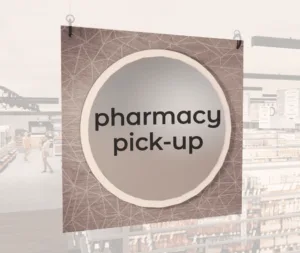 Modern Collection's large department sign with digitally printed text "pharmacy pick-up" centered on a circular overlay.