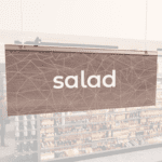 Modern Collection's singled sided small hanging dept sign with digitally printed white dimensional centered text "salad."