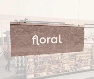 Modern Collection's singled sided small hanging department sign with digitally printed white dimensional text "floral."