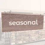 Modern Collection's singled sided small hanging department sign with digitally printed white dimensional text "seasonal."