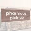 Modern Collection's singled sided small hanging dept sign with digitally printed white dimensional text "pharmacy pick-up."