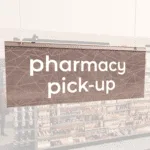 Modern Collection's singled sided small hanging dept sign with digitally printed white dimensional text "pharmacy pick-up."