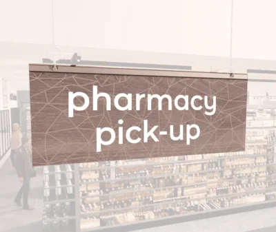 Modern Collection's singled sided small hanging dept sign with digitally printed white dimensional text "pharmacy pick-up."