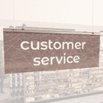 Modern Collection's singled sided small hanging dept sign with digitally printed white dimensional text "customer service."