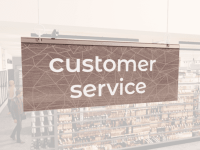 Modern Collection's singled sided small hanging dept sign with digitally printed white dimensional text "customer service."