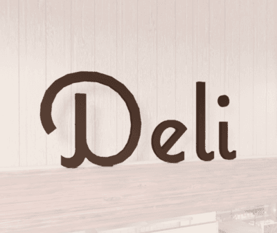 Natural Collection's wayfinding department sign wall copy for Deli or Prepared Food. Wood letters with a painted finish.