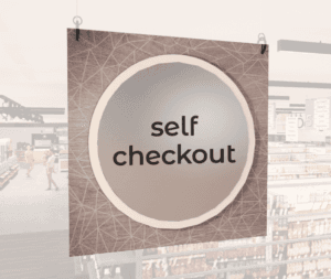 Modern Collection's hanging self-checkout section wayfinding sign with a centered circular overlay & black dimensional text.
