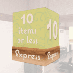 Checkstand light cube for the express lane from Shop2It Retail's Natural Collection. The cube is white acrylic with a green media wrap and wood look base.