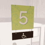 Natural Collection's double-sided hanging sign for ADA Accessible Lane with customizable numbers for your unique layout.