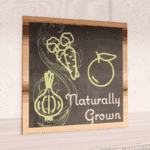 Natural Collection's 31.5 inch square wall-mounted graphic with text "Naturally Grown" for Produce Department Wayfinding.