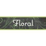 Natural Collections Floral department hanging sign front side has image and text and the backside is a solid green to match.