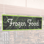 Natural Collection's wayfinding hanging dept sign for "Frozen Foods," in white text on 6 millimeter PVC and a green frame.