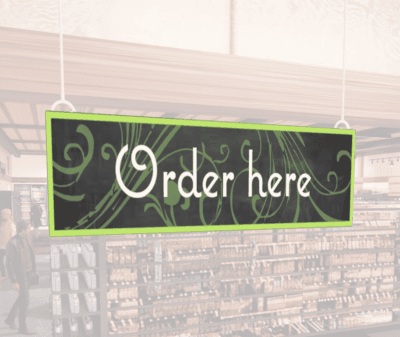Natural Collection's wayfinding hanging department sign that has "Order Here," digitially printed in white text and on PVC.