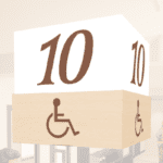 Traditional Collection's checkstand cube for ADA lane in white acylic with digitally printed brown vinyl media numbers.