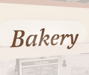 Traditional Collection's department sign for Bakery that is wall mounted with dimensional wood letters with a painted finish