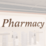 Traditional Collection's wayfinding Pharmacy dept sign that is wall mounted with dimensional wood letters & a painted finish