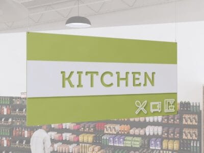 Kitchen Department Sign from Shop2It Retail's Iconic Collection has cutout text, revealing color underneath and dimensional icons.
