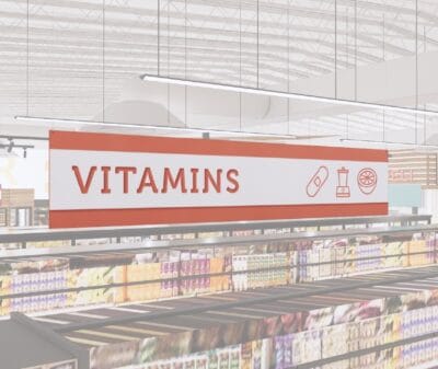 Vitamins section short department sign in the Iconic Collection's cheerful color scheem