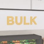 Department sign wall copy for the bulk department from the iconic collection's cheerful color selection.