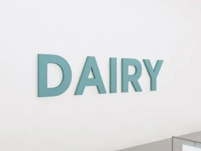 department sign wall copy for the dairy department from the Iconic Collection's Cheerful color selection.