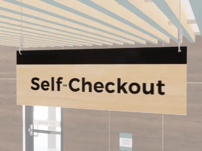 Self-checkout sign with black text and a black stripe on a wood grain background. Double sided from Shop2it Retail.